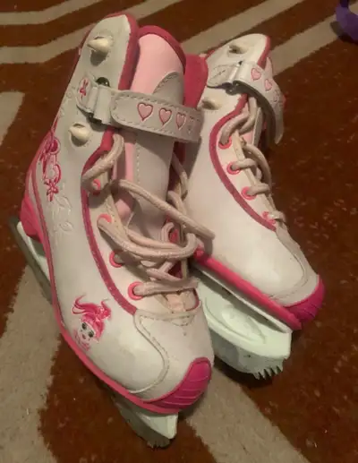 White and pink CCM figure skates , View more