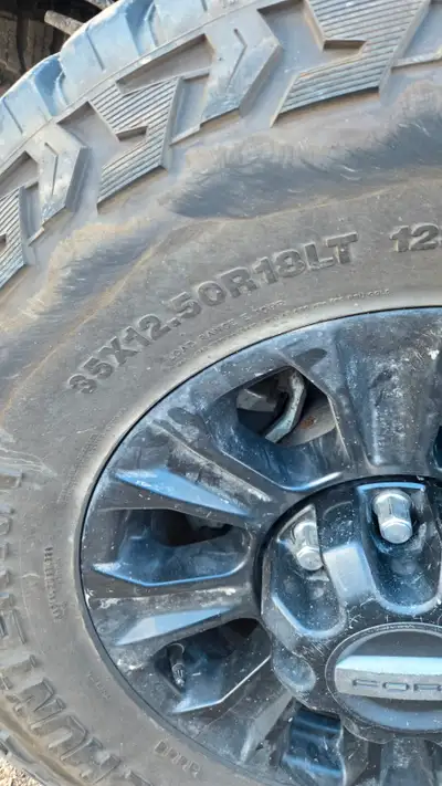 Four Venom Power Trail Hunter R/T studable tires and Ford Rims. Size 35x12.50 R18. Good condition an...