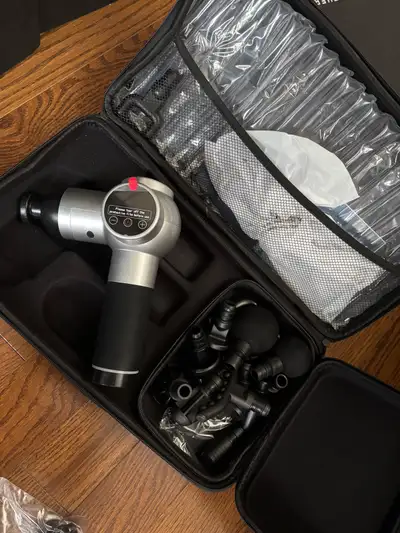 This massage gun is in like-new condition and comes with all attachments and carrying case. It featu...