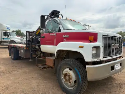 1994 GMC Topkick picker truck for sale. Solid older unit that’s ready to go to work—ideal for farm,...