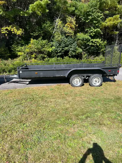 Utility trailer that is 60” wide by 14’ long. It is a wired for four pins and lights work. The rear...