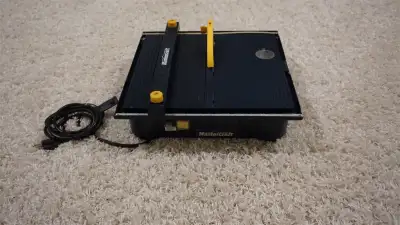 I'm selling a Mastercraft Wet Tile Saw, perfect for precise tile cutting. It features a 4 1/2-inch d...
