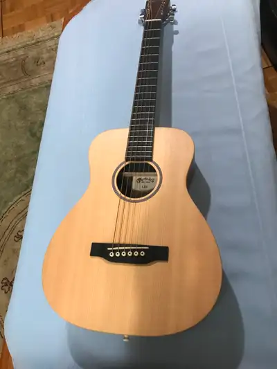 This guitar is great for new and old. This one is in perfect condition and comes with the Martin Gig...