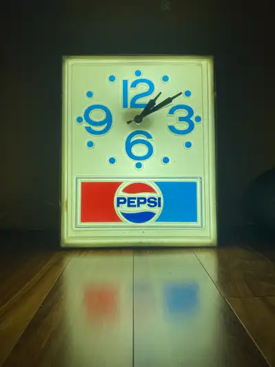 Offered is a nice light up PEPSI advertising clock. Lights up perfectly. Clock is currently not work...