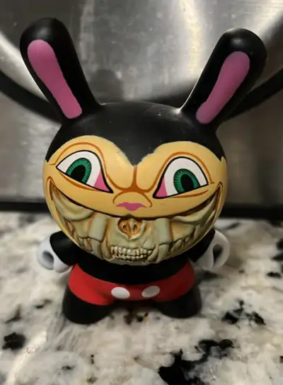 Add a touch of edgy art to your collection with this Kidrobot Dunny Apocalypse 2012 featuring Mickey...