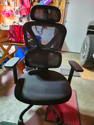 Upgrade your workspace with this ergonomic mesh office chair, designed to provide excellent lumbar s...