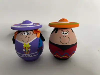 Hand-painted salt and pepper shakers featuring a cheerful Mexican man and woman with sombreros. * Ma...