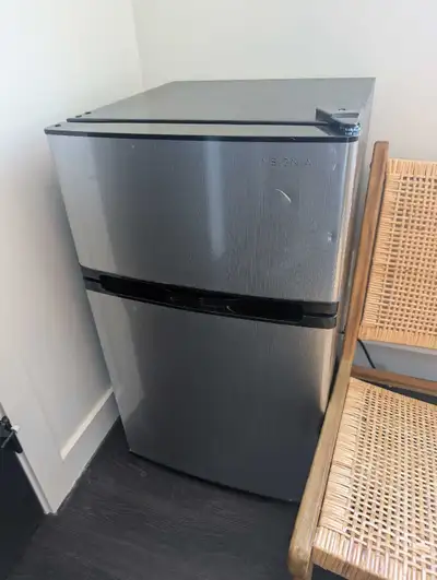 This Insignia stainless steel mini fridge is in good working condition, perfect for keeping your bev...
