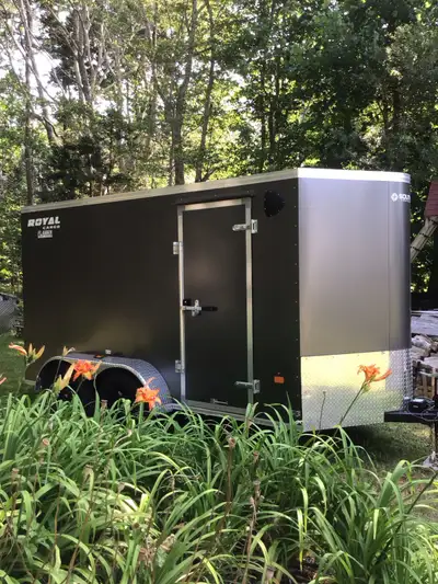 This Royal Cargo trailer is nearly new and ready for your hauling needs. It features a sturdy build...