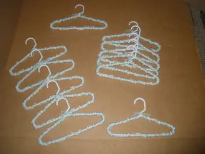 Never used!!!. Handrafted - "pretty" hangers for infant//toddler girls' clothes. 13 matching hangers...