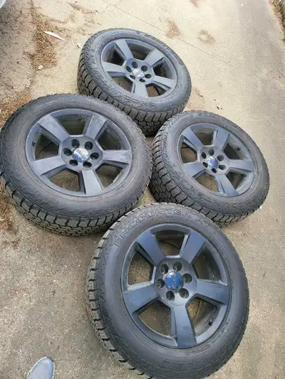 OEM GMC 20inch rims 6x139.7 bolt pattern wrapped in 275 55 20 sumitomo AT encounter tires with 90% T...