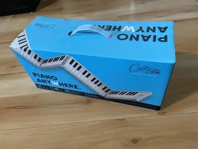 Carry On 88- Key Folding Piano and MIDI Controller White, View more