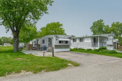 Welcome to 580 Beaver Creek Road Unit 215. This modular home is located on a quiet road within Green...
