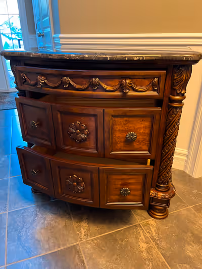 Very useful storage chest. The dimensions are: 35 1/4"W x 20"D x 33 1/2H. The two bottom drawers are...