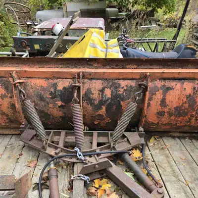 8 foot snow plow , harness and 12v salt spreader . Plow needs a little tlc or cut it down to fit wha...