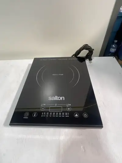This is a used Salton induction cooktop, model ID1350, perfect for quick and efficient cooking. This...