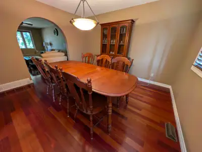 Moving sale. Dining room table that can seat 8 people, 6 chairs, and buffet (with background lightin...