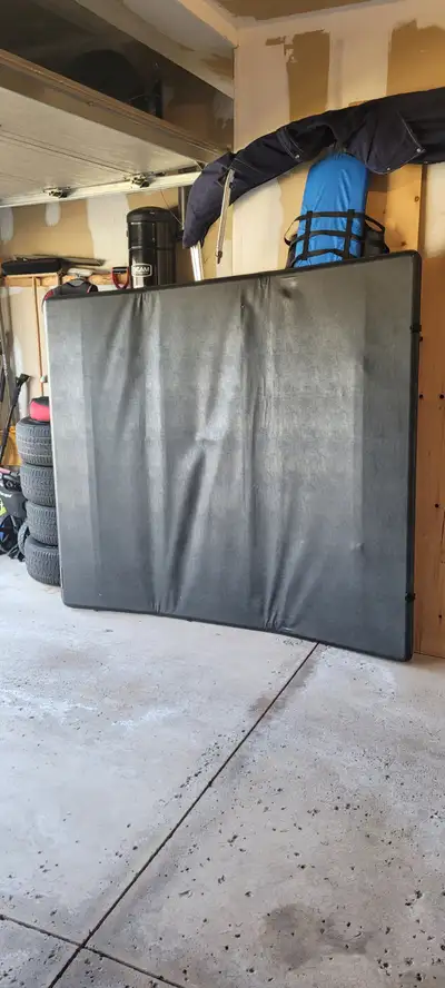 Truck bed cover made by Xtang, Trifecta 2.0. Black soft tonneau leather, that folds up into 3 sectio...