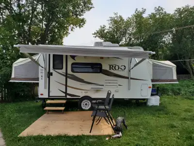 Double flip out trailer with full bath, stove, large fridge/freezer, heat, a/c, LED lights. 3850 lb...