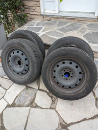 Set (4 ) of Pirelli P4 all-season tires mounted on steel rims