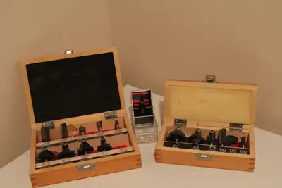 Two sets of various router bits. A few are used, but most have not been used. 1/4 inch straight bit...