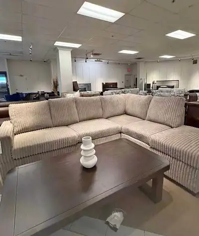 This plush, corduroy-textured sectional sofa is in good, pre-owned condition and offers a spacious s...