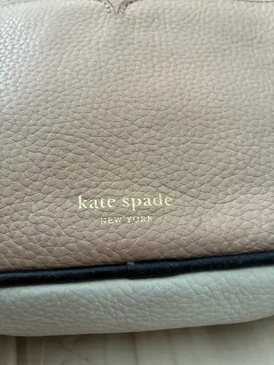 Kate Spade crossbody bag - pink, white, black - adjustable strap - 1 exterior pocket, 2 interior car...
