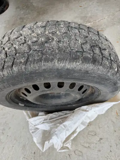 Lots of tread -set of 4 -includes rims Please call 519-330-7112