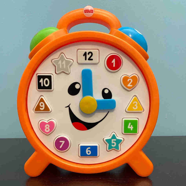 Fisher price clock for kids in Toys in Winnipeg
