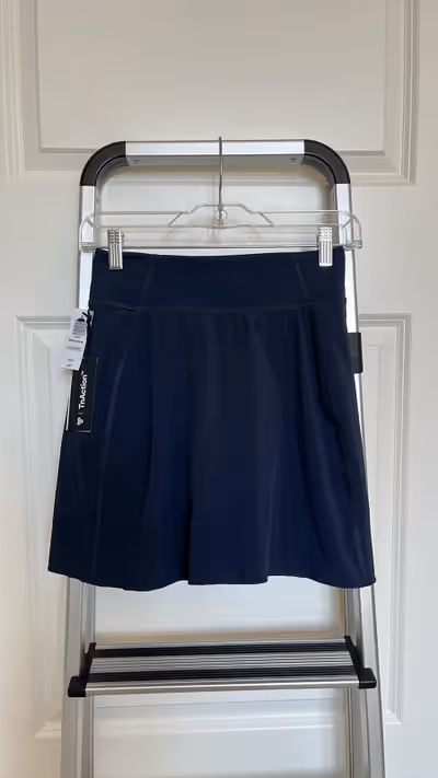 This skirt with shorts is navy and brand new from Aritzia. Tags still attached. Never worn. Great fo...