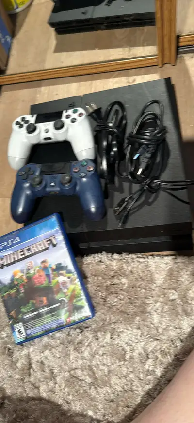 Very well taken care of ps4 with 2 controllers and 2 games, View more
