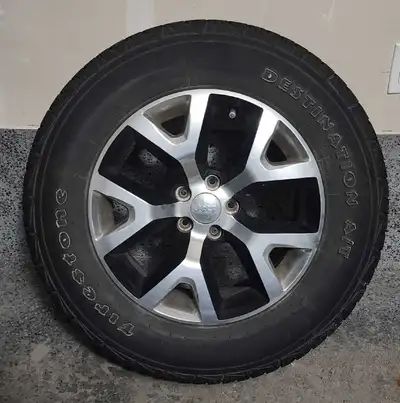 4 all season Firestone tires (P245/65R17) on original Jeep light weight aluminum rims. Plus set of 4...