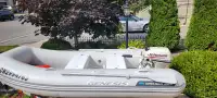Walker Bay hard bottom dinghy with 15 HP Johnson outboard