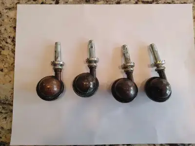 Set of 4 furniture casters. Dark brown copper in colour. One castor needs some polishing to remove t...