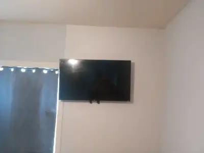 Smart tv with wall mount little under 2 year's old