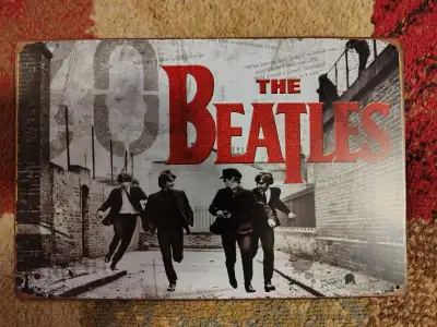 The Beatles Collectible Tin Sign Approximately 12 inches wide by 8 inches tall $5 Pick up in Acton