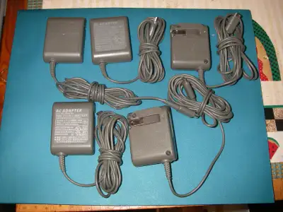A few chargers/power adapters for sale. 5 for Nintendo DS Lite and 2 for Nintendo Game Boy Advance....
