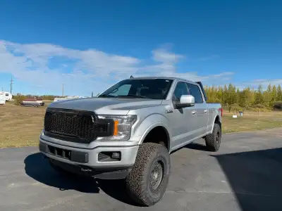 This is a 2019 Ford F-150 SuperCrew Lariat, a powerful and stylish pickup truck ready for any advent...