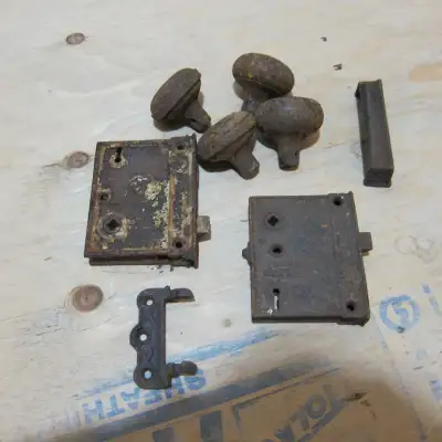 Group of old door lock castings. Come as shown in the pics. Great is you are restoring an old house...