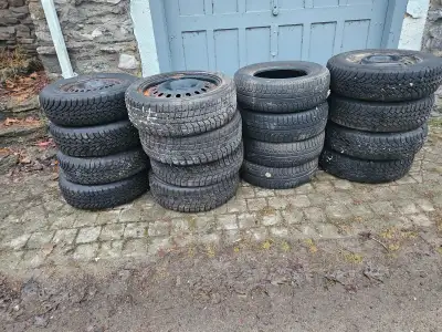 Four sets of winter tires. Three sets have rims, one does not. Some rims have rust, but none are as...