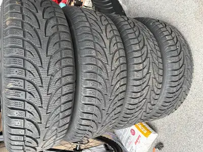 Winter Claw tires on rims. 9/32 tread remaining (80%) on directional winter tires. Excellent conditi...