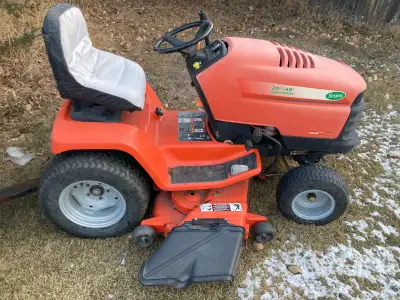 We are selling an older Scott's garden tractor manufactured by John Deere, featuring a 20 horsepower...