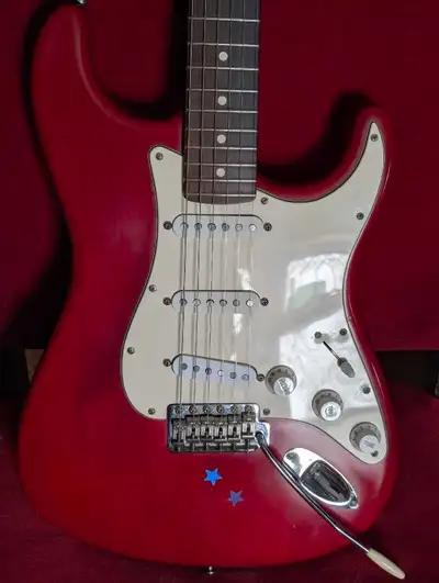 Really nice weight, great Crimson Red color. Has upgraded Fender american pickups. Beautiful Rosewoo...