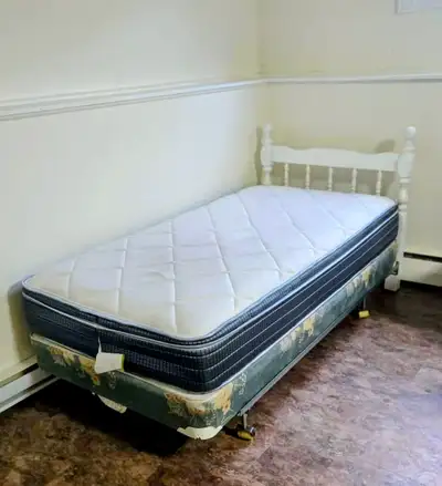 Single bed with headboard, box spring, frame and pillow top mattress. Smoke-free home, mattress has...