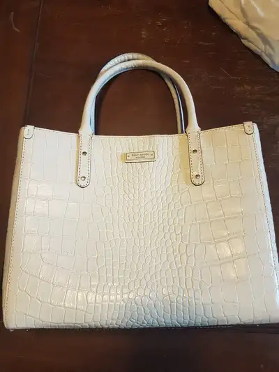Selling off white Kate Spade bag. Great condition. 12" Wide, 9" High, and 3" thick