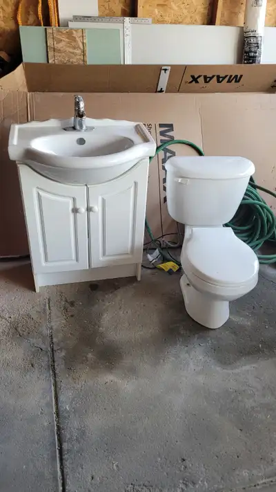 24" vanity including faucet in great shape, there's only a plumping hole inside. Text Matt 403-667-0...