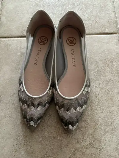 Add a touch of sparkle to your step with these Staccato silver ballet flats, perfect for adding some...