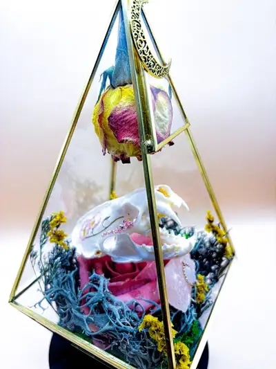 Gorgeous Mink Skull with floral accents in a hanging glass pyramid terrarium. Adorned with a high qu...