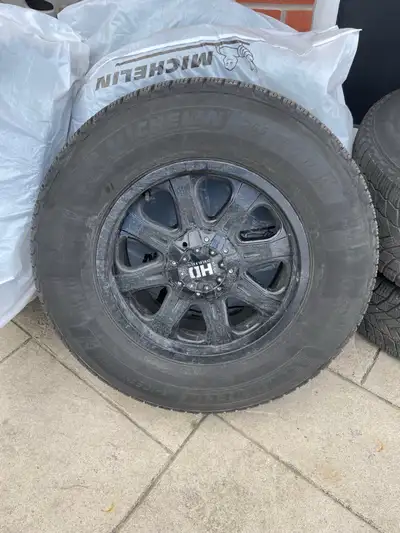 17” Ford/GMC truck rims with 265-70-17 Michelin Xice snow winter tires. In good condition. Tires hav...