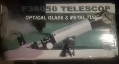 Explore the stars with this F360650 telescope, featuring optical glass and a metal tube for clear vi...